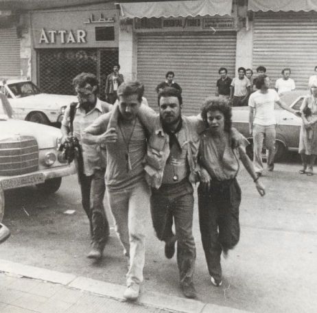 Me being helped into the Commodore Hotel in Beirut on Aug. 2, 1982 by Vincent Schodolski and Cynthia Nuckolls (who later became my wife). Frank Dougherty is on the left. I had suffered a broken ankle when an Israeli 155mm White Phospherous shell hit the UPI office.